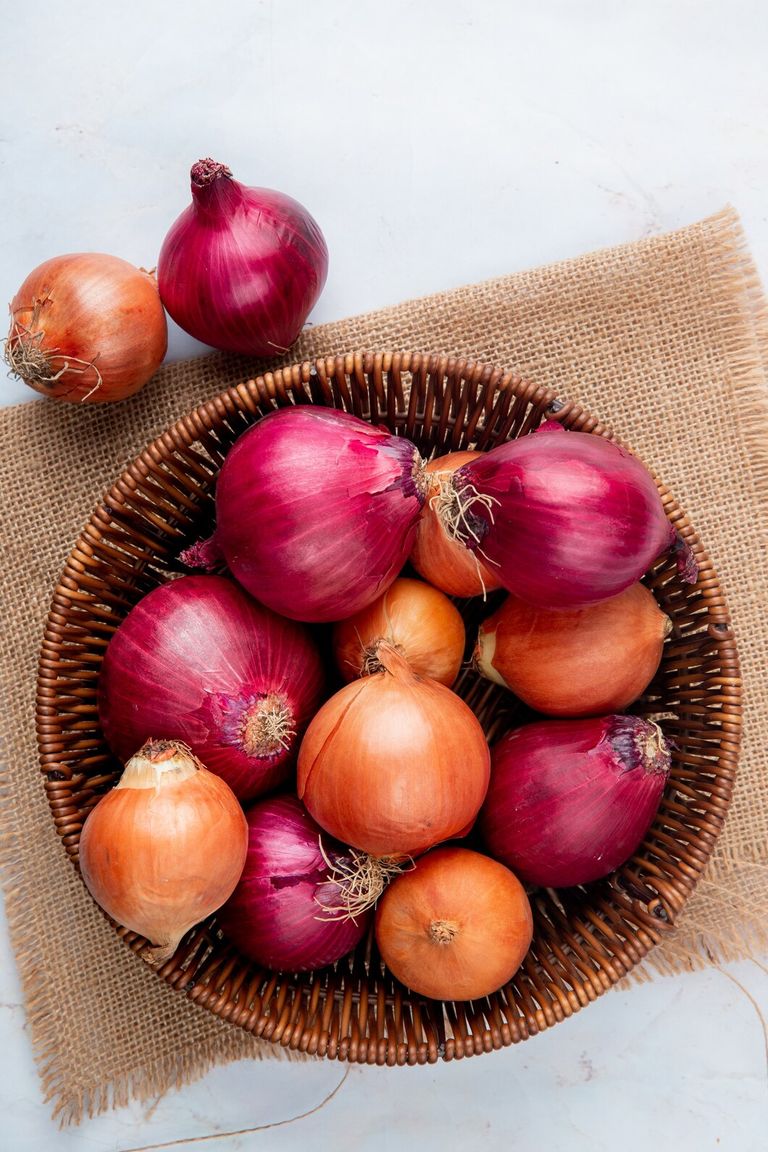 top-view-basket-full-onions-sackcloth-white-background_141793-5887.jpg