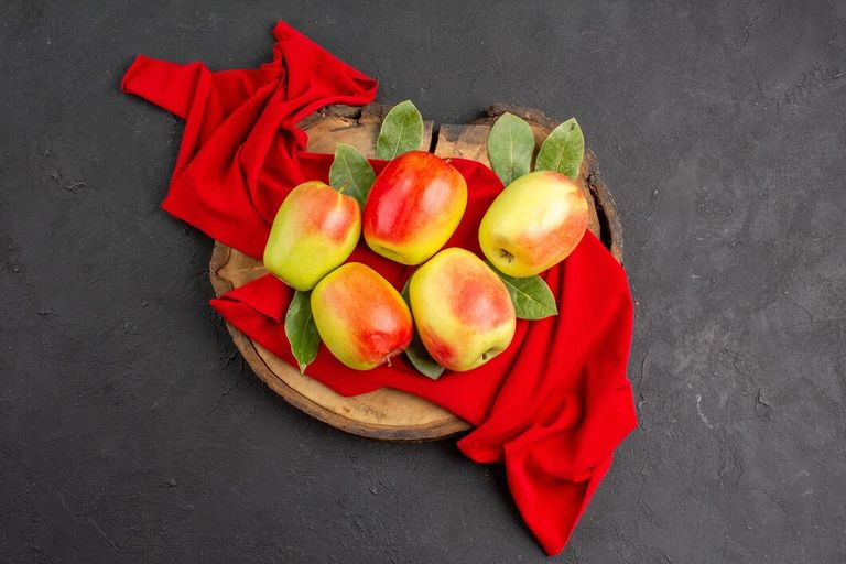 top-view-fresh-apples-ripe-fruits-red-tissue-grey-table-ripe-fruit-fresh_140725-126604.jpg