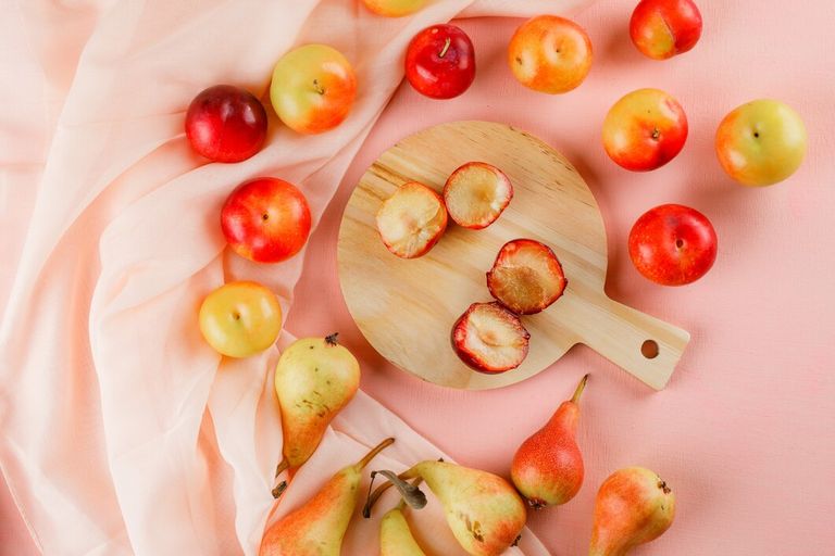 pears-plums-with-cutting-board_176474-6933.jpg