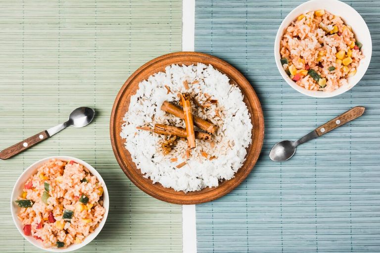 high-angle-view-fresh-chinese-fried-steam-rice-with-cinnamon-sticks-placemat_23-2147901843.jpg