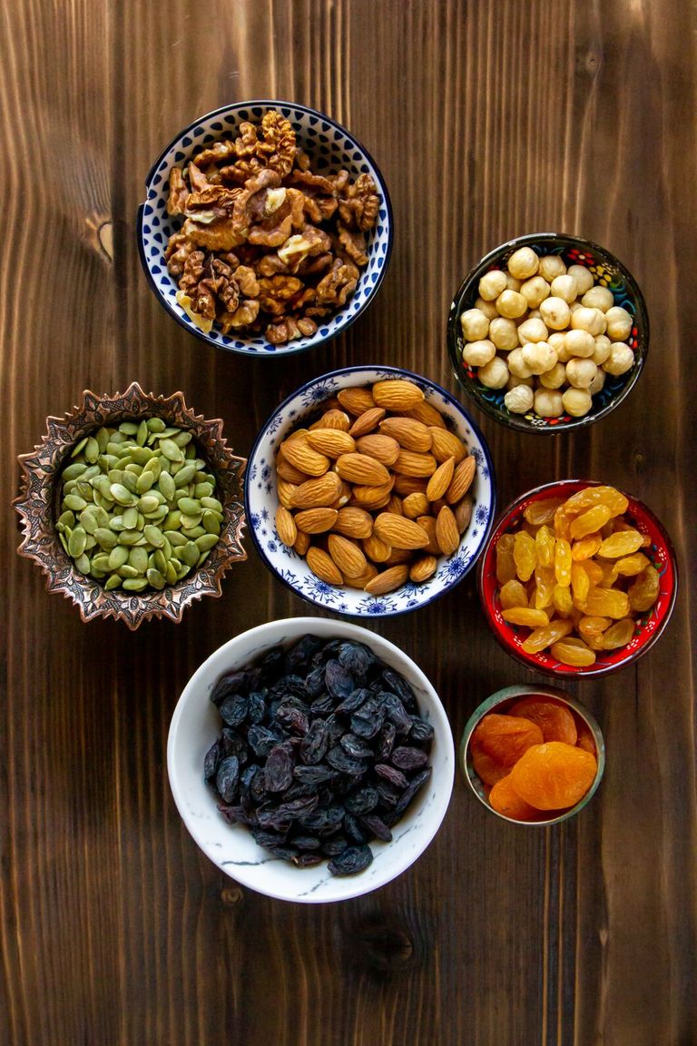 top-view-mix-nuts-dried-fruits-almonds-raisins-pumpkin-seeds-with-dried-apricots-table_140725-9083.jpg