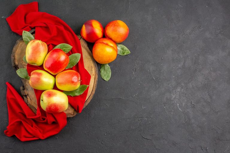 top-view-fresh-apples-with-peaches-dark-table-color-fresh-ripe-fruit_140725-126792.jpg