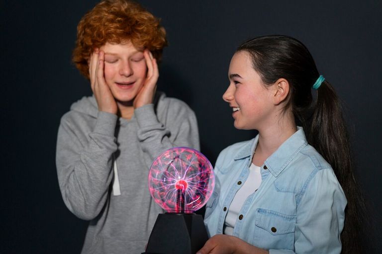 medium-shot-kids-interacting-with-plasma-ball_23-2150591678.jpg