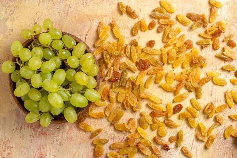 top-close-up-view-grapes-green-grapes-bowl-raisins_140725-73482.jpg