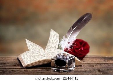 old-book-rose-feather-ink-260nw-126164411.jpg