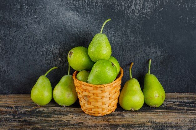 pears-basket-wooden-dark-wall-high-angle-view_176474-8693.jpg