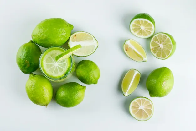 lemonade-glass-with-lemons-herbs-straw-top-view-white_176474-7387.webp