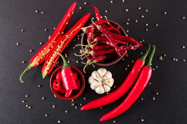 red-chili-pepper-sliced-with-garlic-pepper-ceramic-bowl-dried-red-chili-pepper-top-view_176474-679.jpg