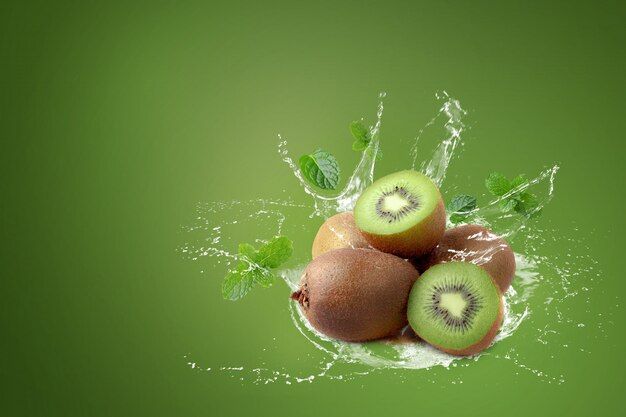 water-splashing-kiwi-fruit-half-kiwi-fruit-green-background_33736-3236.jpg