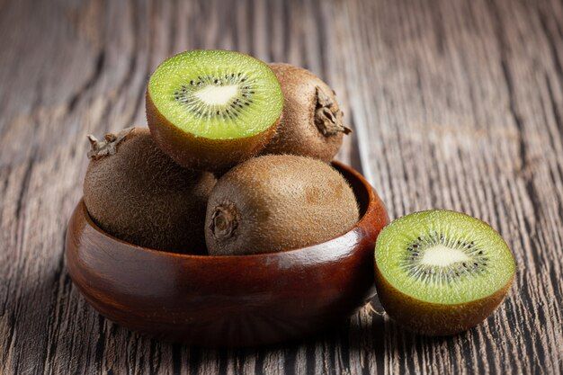 fresh-kiwi-cut-into-half-put-wooden-bowl_1150-28120.jpg