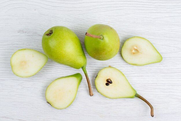 top-view-fresh-green-pears-sliced-whole-white-background-fruit-color_140725-22740.jpg