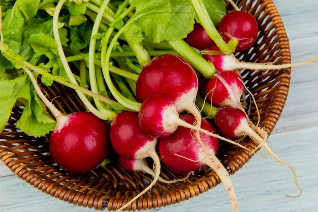 close-up-view-radishes-basket-wooden-background_141793-9401.webp