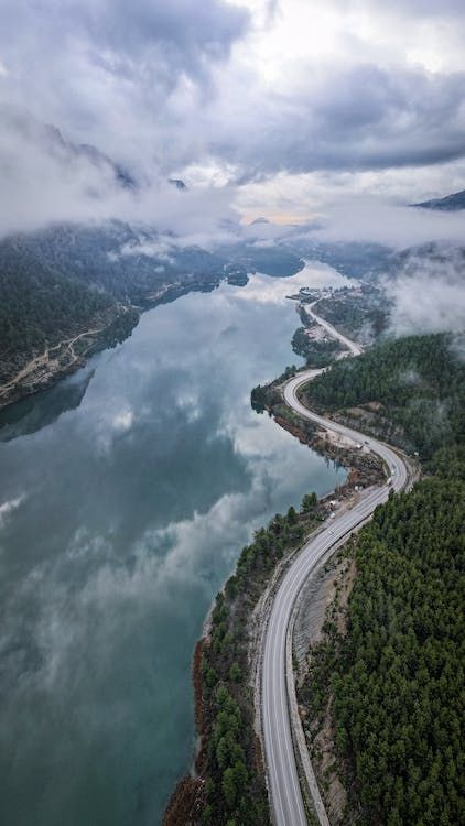 free-photo-of-road-by-river-in-valley.jpeg