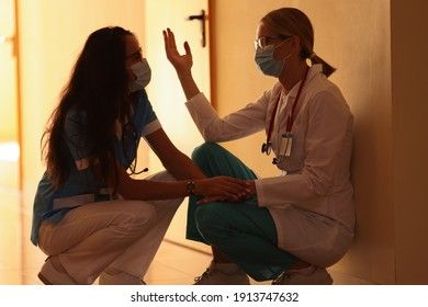 two-frustrated-doctors-sitting-hospital-260nw-1913747632.jpg