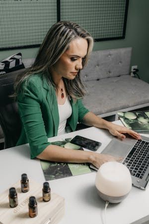 free-photo-of-woman-sitting-at-a-desk-and-typing-on-a-laptop.jpeg