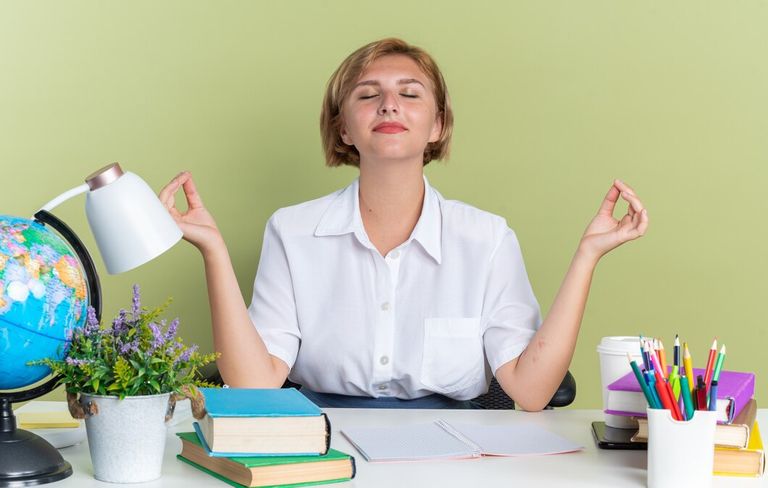 peaceful-young-blonde-student-girl-sitting-desk-with-school-tools-meditating-with-closed-eyes-isolated-olive-green-wall_141793-113655.jpg