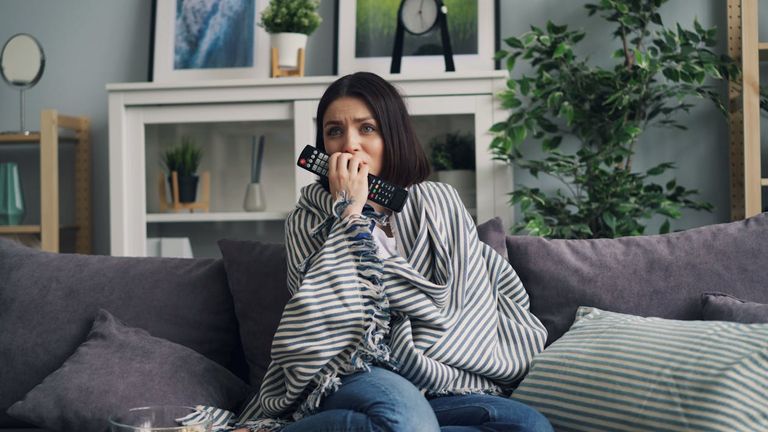 free-photo-of-worried-woman-sitting-with-blanket-on-couch.jpeg