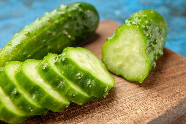 front-view-fresh-green-cucumbers-sliced-blue-background-meal-salad-health-photo-ripe-food-diet-color_140725-98124.jpg