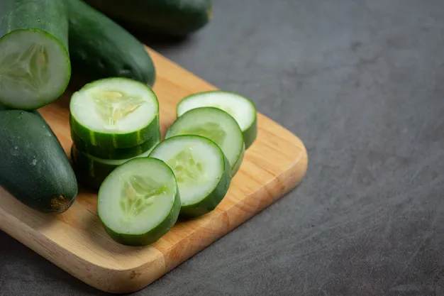 fresh-cucumbers-sliced-dark-background_1150-45035 (1).webp