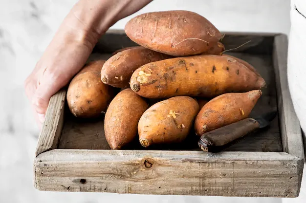 sweet-potatoes-wooden-box_53876-96848.webp