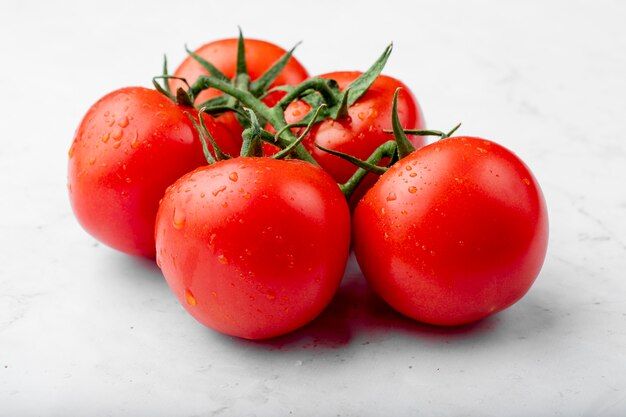 side-view-ripe-fresh-tomatoes-with-water-drops-white-background_141793-3400.jpg