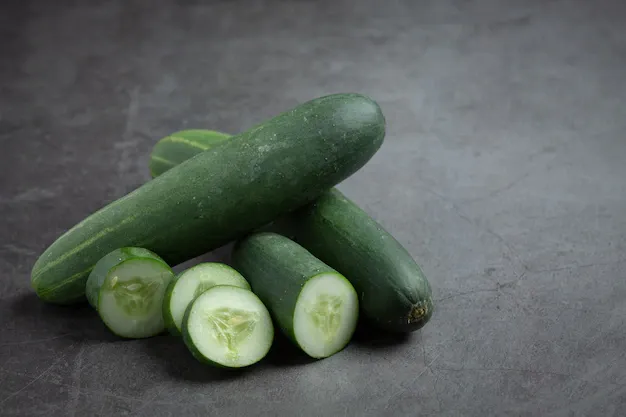 fresh-cucumbers-sliced-dark-background_1150-45029.webp