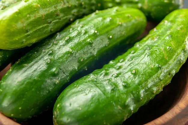 front-view-fresh-green-cucumbers-blue-background-meal-salad-health-ripe-food-diet-color-photo_140725-98122.webp