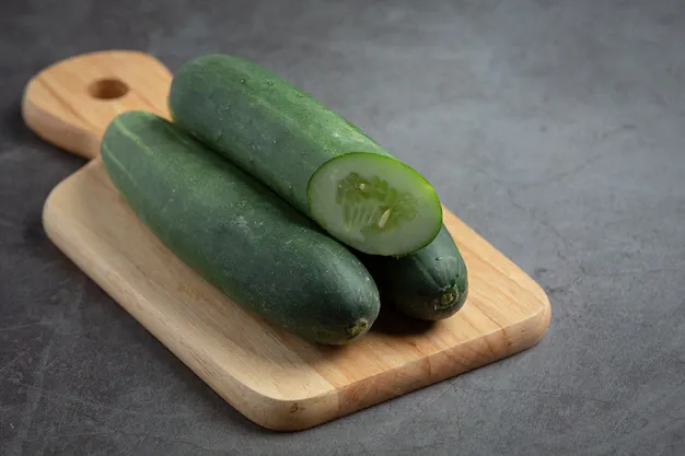 fresh-cucumbers-sliced-dark-background_1150-45028.webp