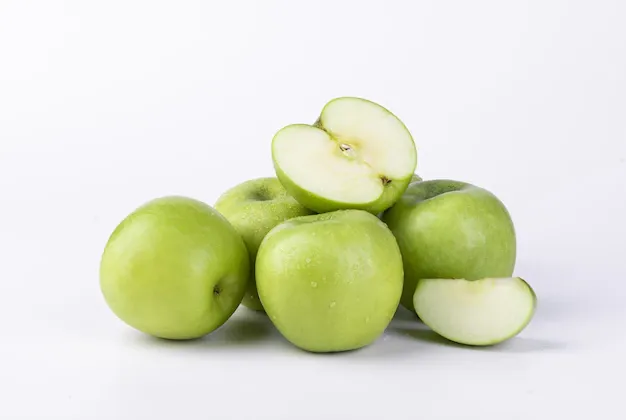 closeup-shot-fresh-sliced-green-apples-isolated-white-wall_181624-51819.webp