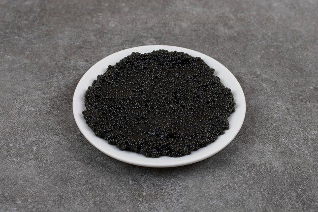 delicious-black-caviar-white-bowl-white-plate_114579-85941.jpg