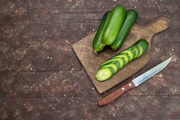 top-view-fresh-green-cucumbers-whole-sliced-dark_140725-18976.jpg