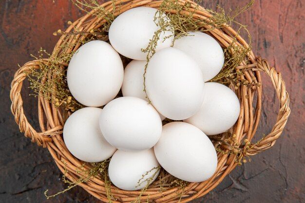 top-view-fresh-chicken-eggs-inside-basket-dark-table_140725-130548.jpg