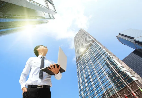 depositphotos_34263041-stock-photo-business-man-with-laptop-and.jpg