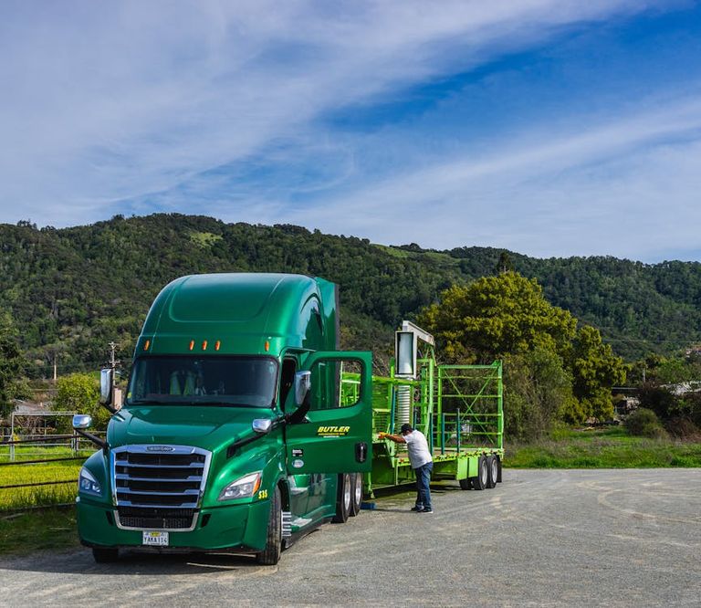 free-photo-of-green-truck-on-a-car-park-in-a-green-landscape.jpeg