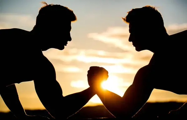 depositphotos_676352988-stock-photo-two-men-arm-wrestling-rivalry.jpg