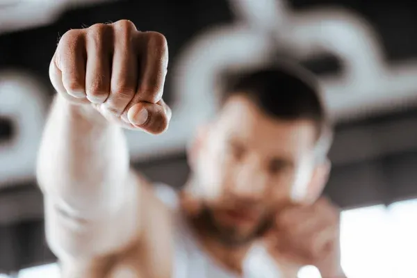 depositphotos_363038850-stock-photo-selective-focus-fighter-clenched-fist.jpg