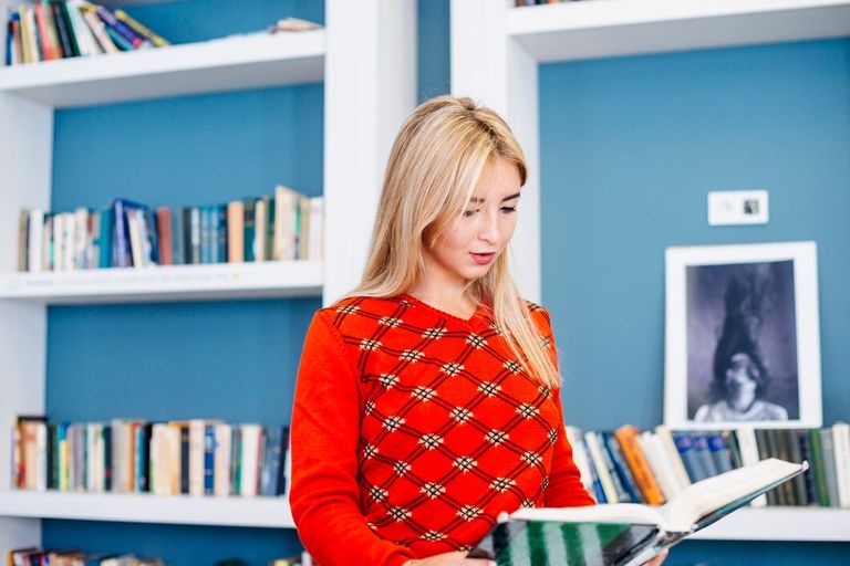 focused-woman-reading-book_23-2147844631.jpg