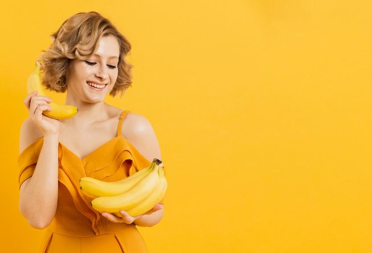 smiley-woman-looking-bananas_23-2148450391.jpg