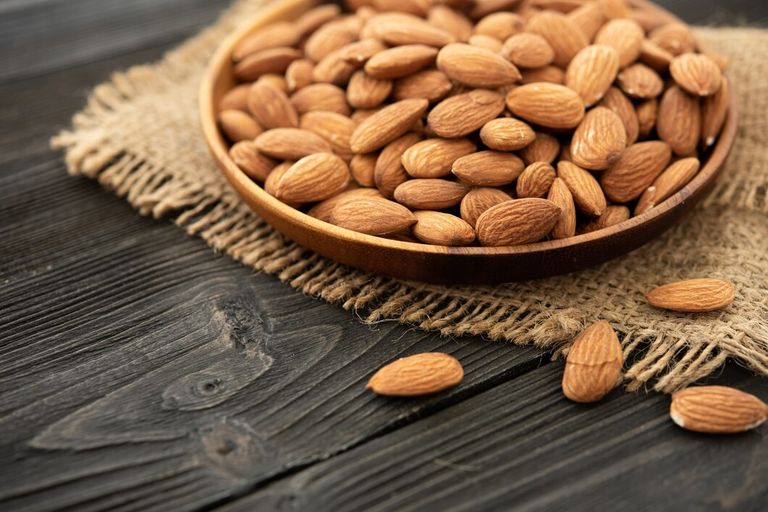 almond-wooden-bowl-wooden-background-near-bag-from-burlap-healthy-food-snack-organic-vegetarian-food_1150-37655.jpg