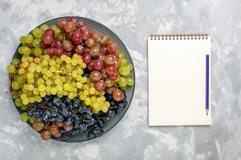 top-view-fresh-grapes-juicy-mellow-fruits-inside-plate-light-white-background-fruit-mellow-juice-wine-fresh_140725-64761.jpg