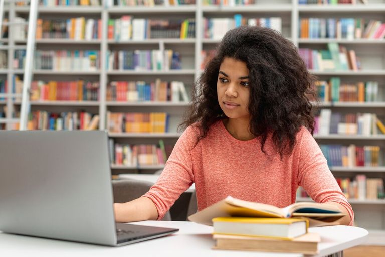 high-angle-girl-library-studying-using-laptop_23-2148448032.jpg