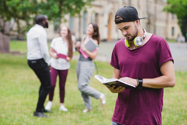 bearded-man-reading-book-standing_23-2147657069.jpg