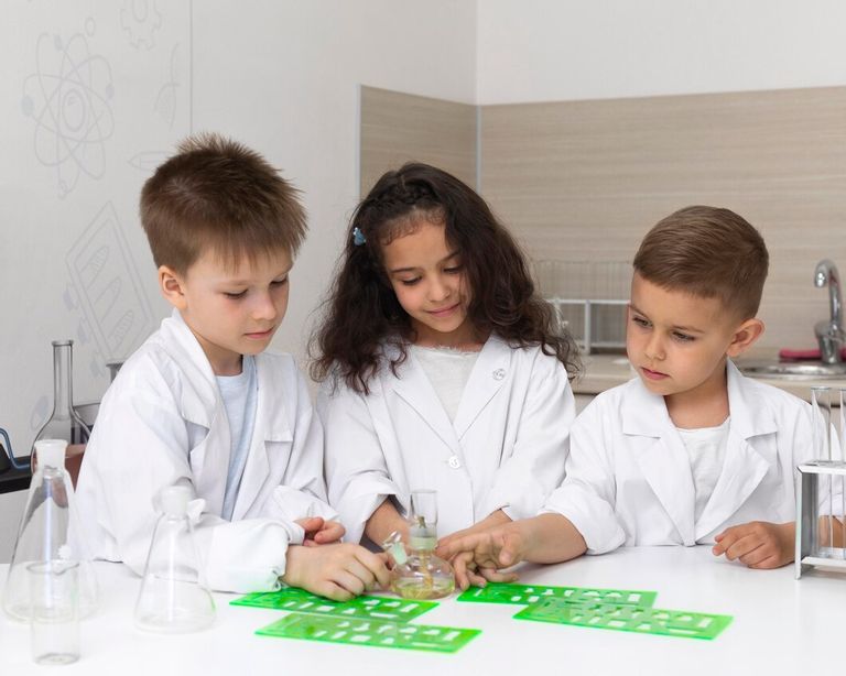 curious-children-doing-chemical-experiment-school_23-2148990182.jpg