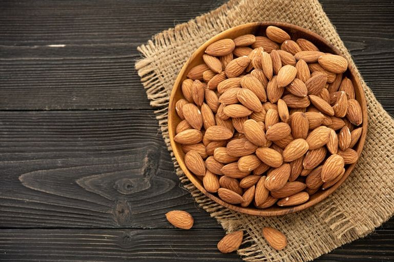 almond-wooden-bowl-wooden-background-near-bag-from-burlap-healthy-food-snack-organic-vegetarian-food_1150-37656 (1).jpg