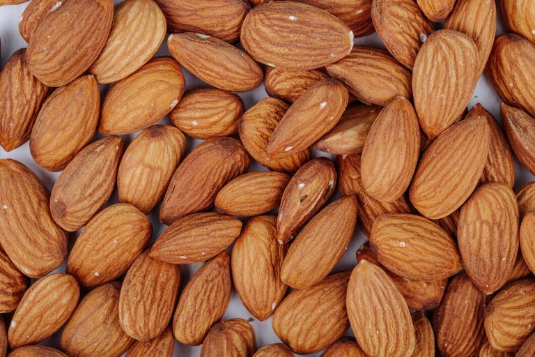 top-view-almond-nuts-white-background_141793-8897.jpg