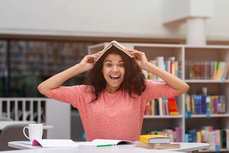 smiley-girl-with-book-head_23-2148448018.jpg