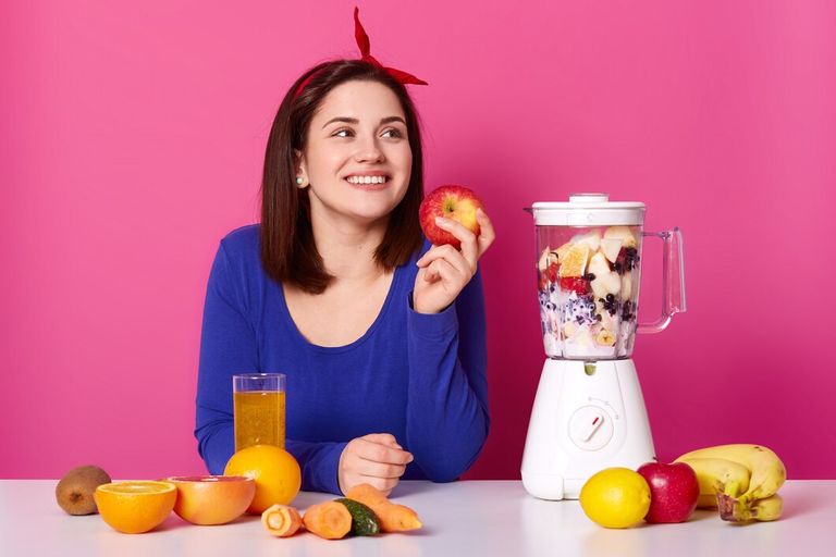 smiling-girl-with-fresh-fruits-table-isolated-pink_176532-9150.jpg
