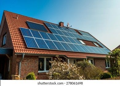 solar-panel-on-red-roof-260nw-278061698.jpg